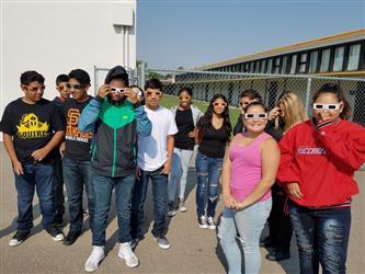 students wearing solar viewing glasses