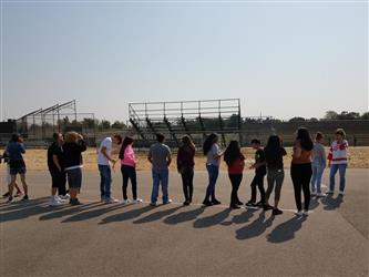 students wearing solar viewing glasses watching eclipse