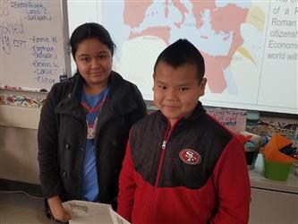 students at front of desks