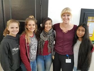 students posing with teacher