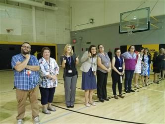 students posing for photo in gym