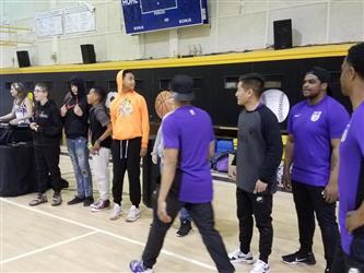 people standing while wearing sports jerseys