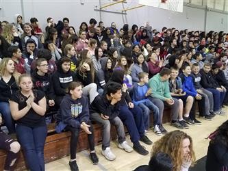 students seated in bleachers