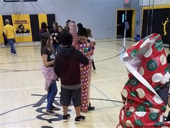 students wrapped in gift paper