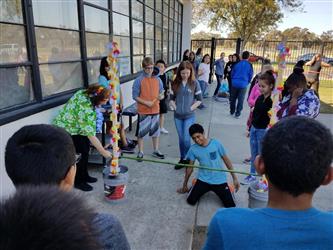 students playing limbo