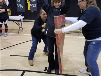 students getting wrapped in gift paper