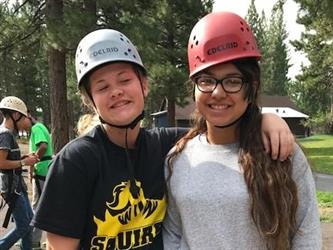 students wearing helmets posing for photo