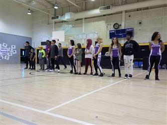 people standing on basketball court