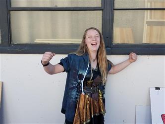 student flexing for camera