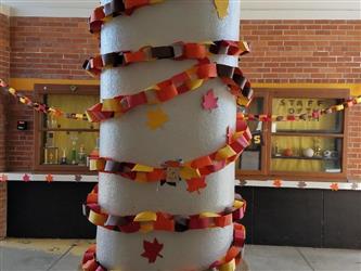 pillar decorated with paper wreath